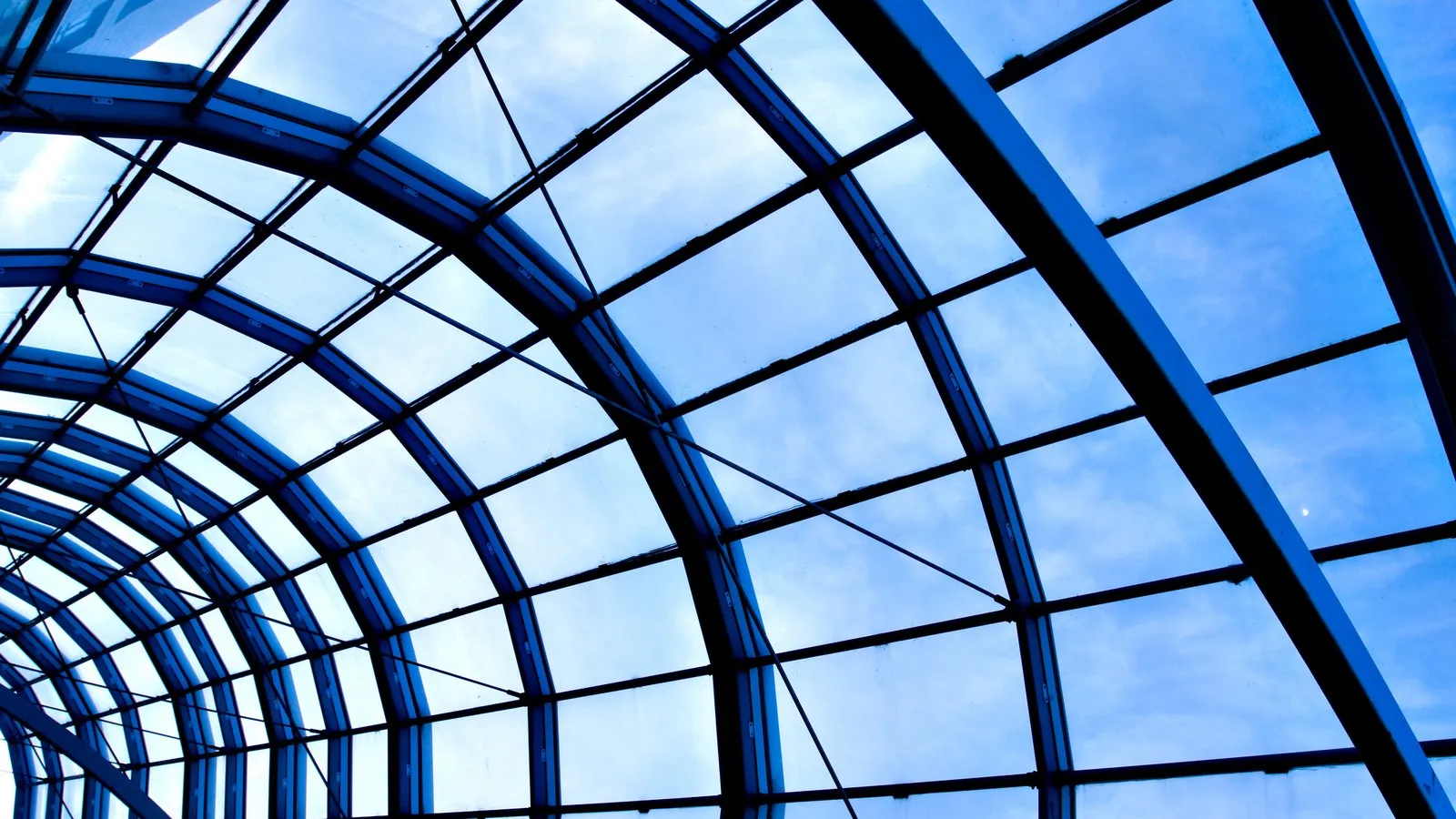 A modern blue glass office ceiling, representing the governance frameworks and structures enterprise AI now depends on