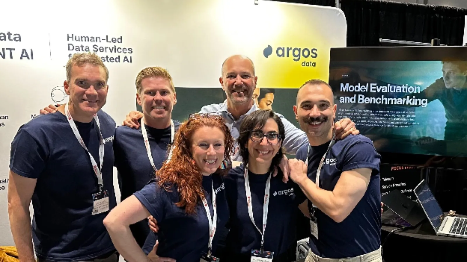 Argos Data team standing together at their booth at the AI and Big Data Expo in San Jose